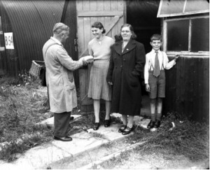 From 1946 some 200 people occupied old army huts at Ranikhet Camp due to housing shortages. Here a young mother receives a delivery of fresh bread from the nearby Grovelands bakery